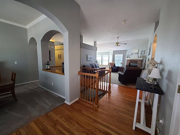 Main entry. Coat closet to right. Master bedroom to right. Dining room to left. Stairs to finished basement and den/family room straight ahead.