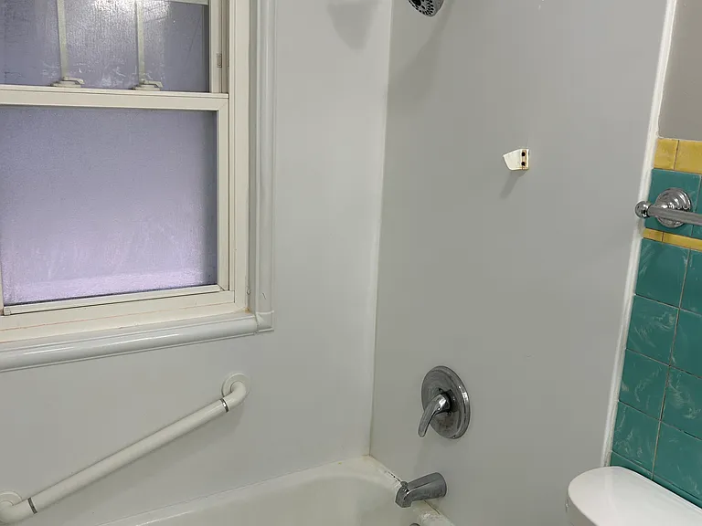 BATHROOM TUB/SHOWER - Bathroom flooring is being changed to plank flooring
