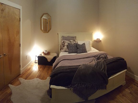 The bedroom is spacious enough for queen size bed with large