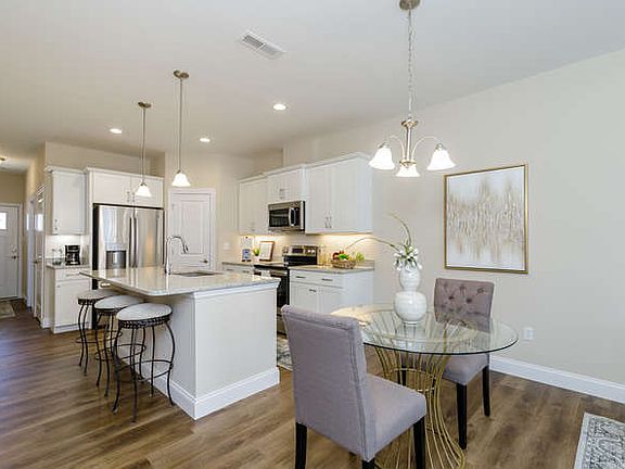 White cabinets, coffee bar, island, crown mould on cabinets, granite counter tops, stainless steel appliances, walk-in pantry and so much more....