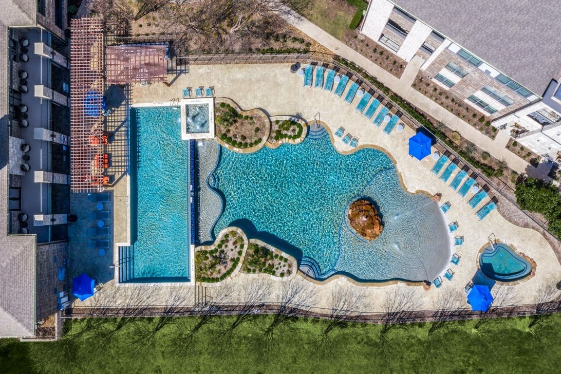 Gorgeous resort-style swimming pool with cabanas