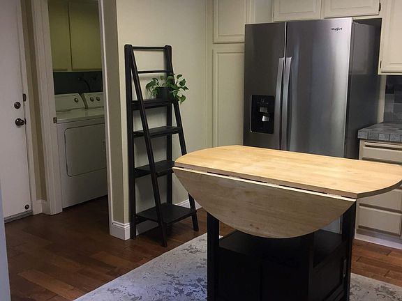 with the laundry tucked in between the kitchen and the garage