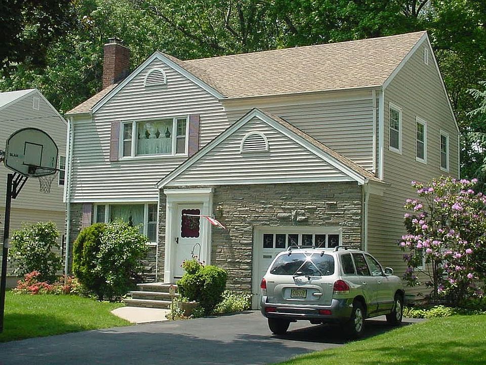 Front view with 2 car wide driveway and new roof