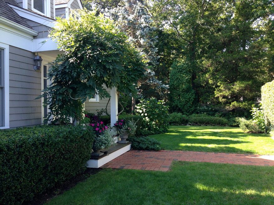 STORYBOOK FRONT YARD WITH LUSH LANDSCAPING