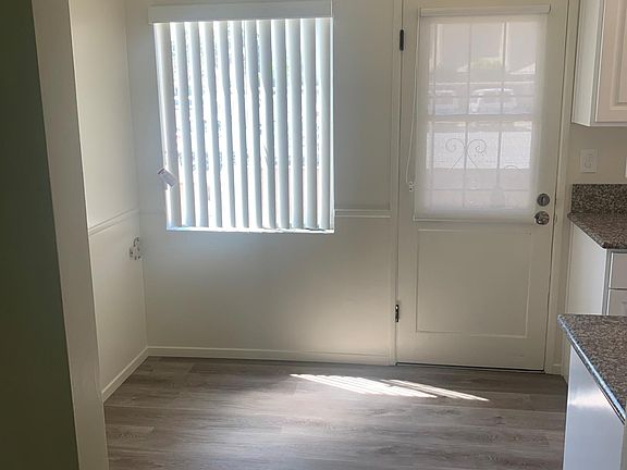 Back Door off Kitchen. New Blinds