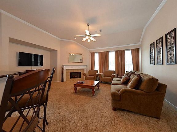 Den features high ceiling, gaslog fireplace, and beautiful view of the huge back yard.