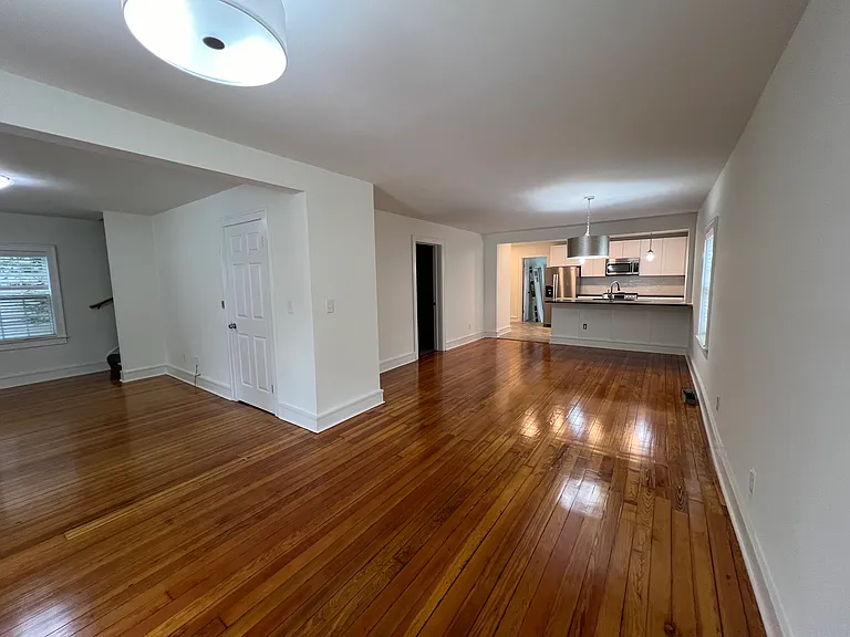 Entry, living room on left, dining area and kitchen on right