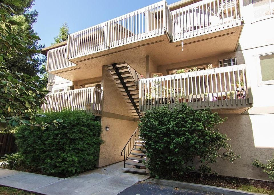 Stairs to unit; covered garage is below the unit.