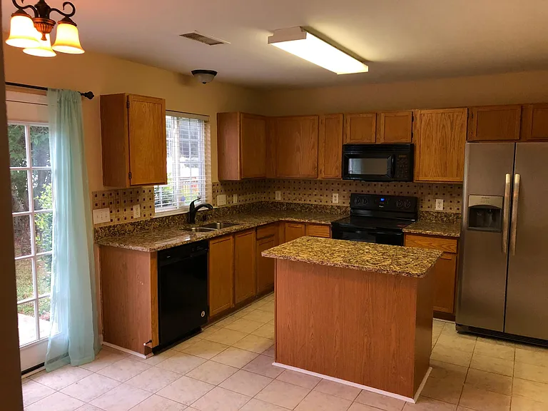 Spacious Kitchen with Tile Floor, Granite, and Like New Appliances