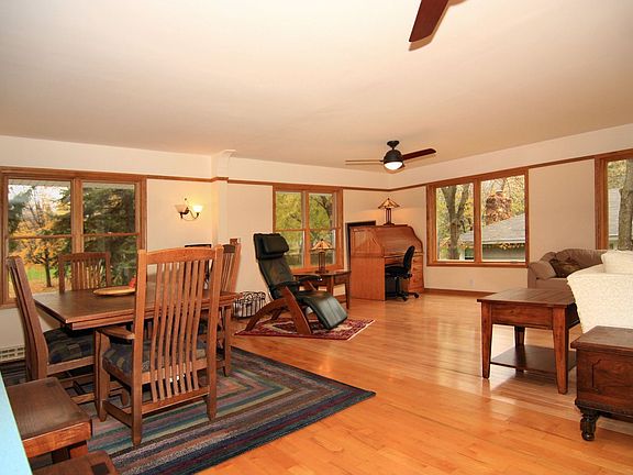 Hardwood floors extend into the newer family room addition.