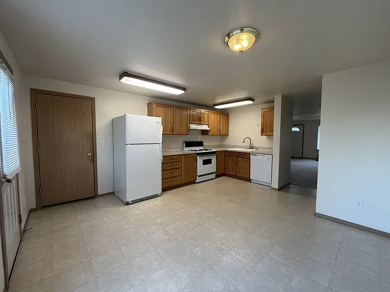 Kitchen and dining with access to garage