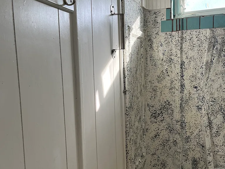 Bathroom #1 with towel hooks and window