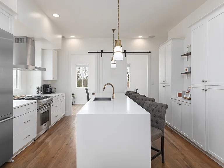 Fully equipped kitchen with stainless steel appliances, seating for 5 at the kitchen island, additional seating at the dining room table and all the dishware / utensils you might need.