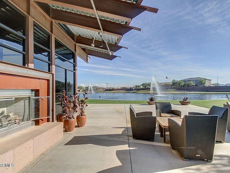 Exterior Fireplace and Seating around the Lake at the Recreation Center