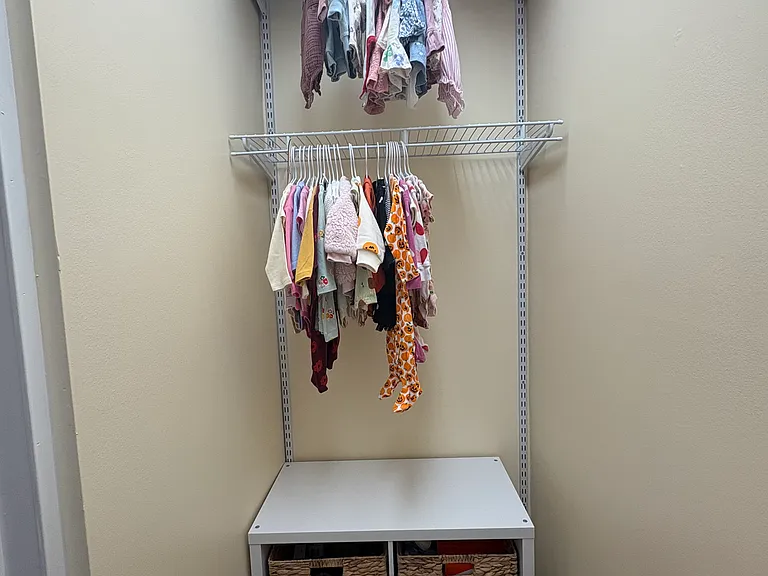 Second bedroom walk in closet with adjustable shelving system