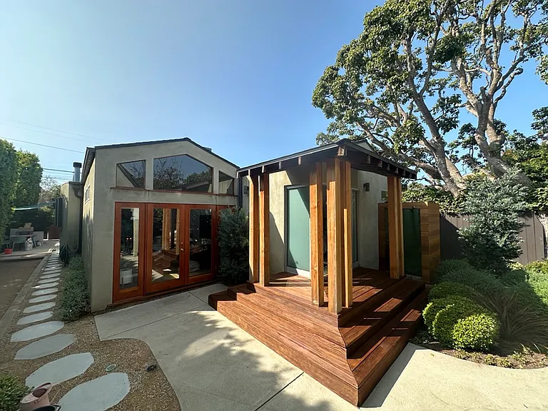 Access to backyard from living area (left side) and master bedroom (right side)