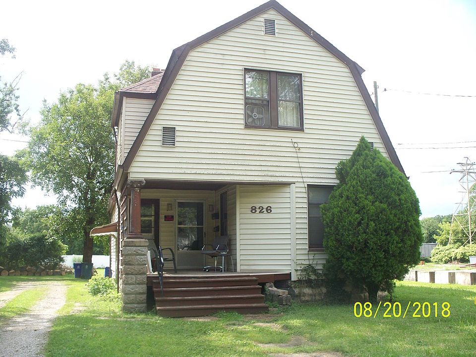 Front of house, door on right is entrance