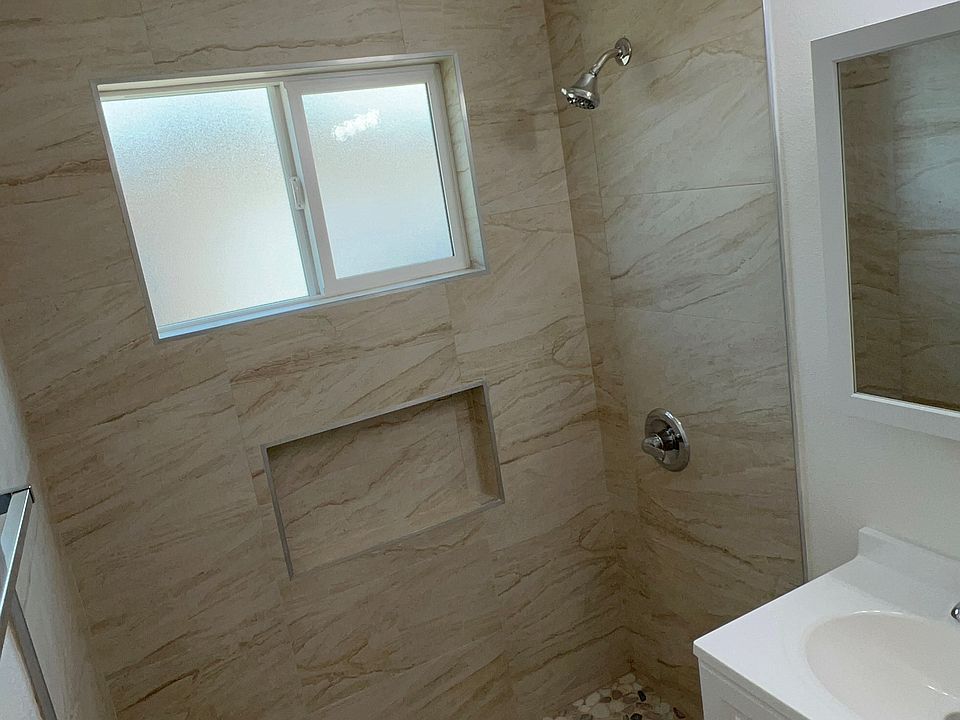 newly remodeled bathroom; new cabinet; new window