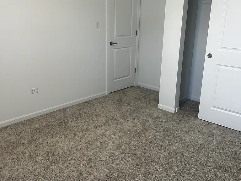 Unfurnished private suite available for $800/month with a 12-month lease. Features a closet for storage and access to shared kitchen, bathroom, and patio spaces. Move-in Special: Sign by the end of the week and receive $200 off your first month's rent!