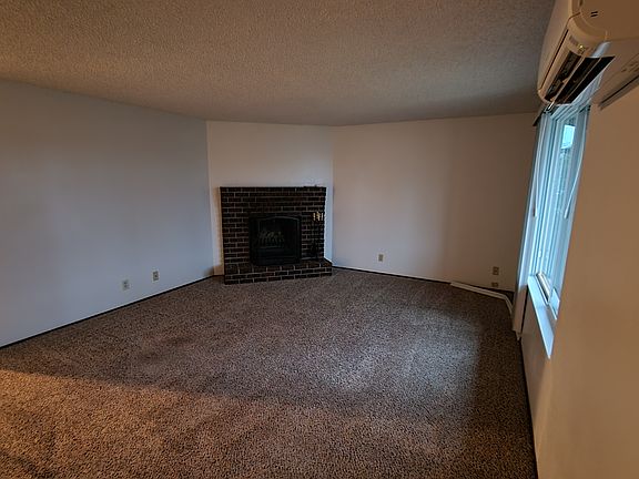Living room with working fireplace.