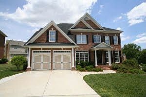 Executive culdesac home w/ carriage doors and beautiful entry