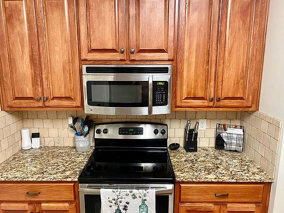 Kitchen microwave and range/oven combo.