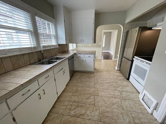 Large kitchen with dishwasher.