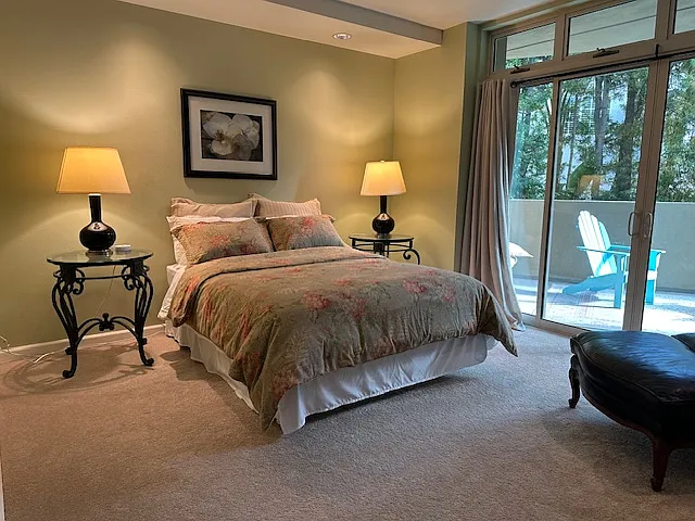 master bedroom with deck and fireplace