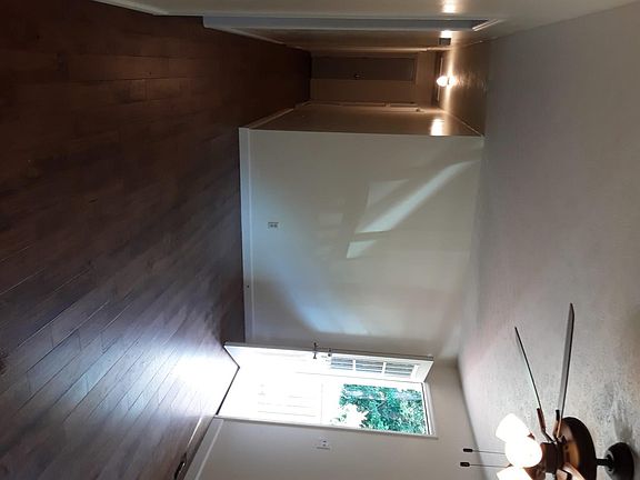 Front door, living room and hallway leading to all bedrooms