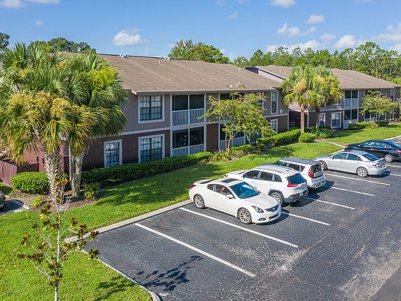 Ample parking and lush surroundings.