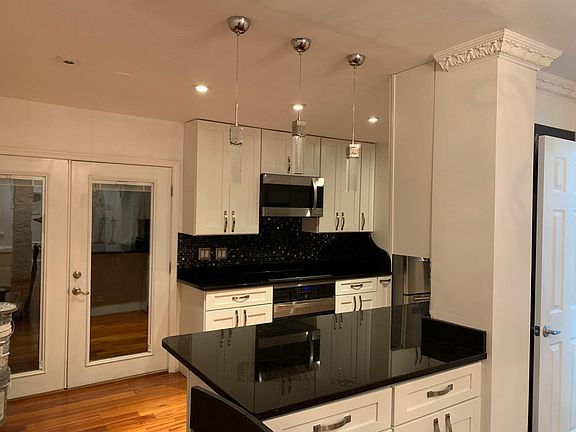 View of Kitchen and French Doors that open to outdoor deck