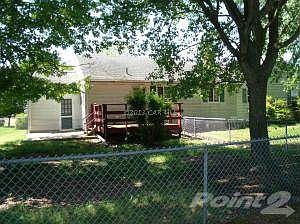 REAR VIEW W/FENCED IN REAR YD & DECK