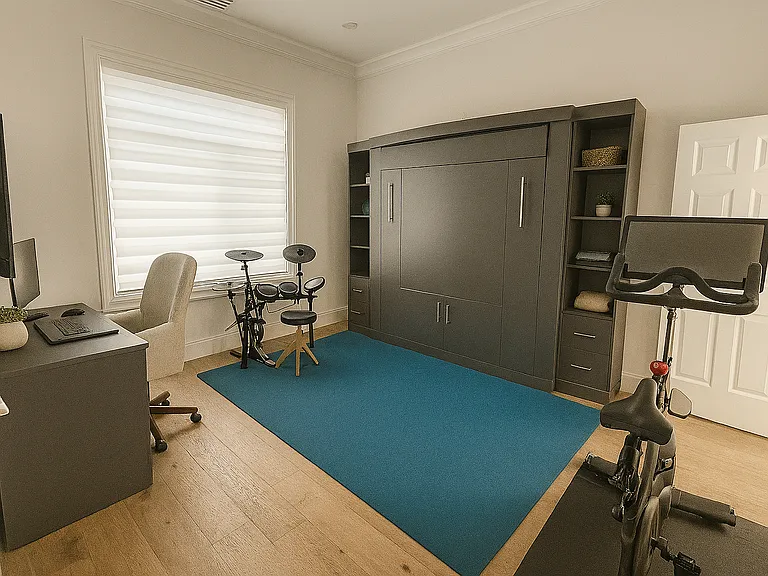 Bedroom with closet and ensuite bathroom that has built in custom built Murphy bed, perfect for utilizing as a multi-function space