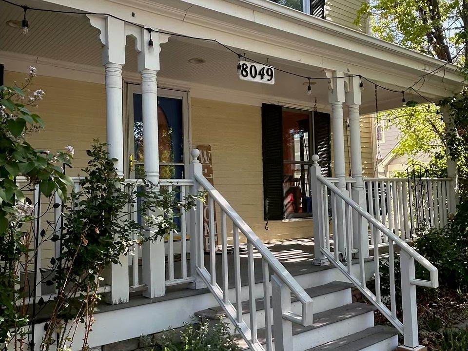 Front of house with big front porch.