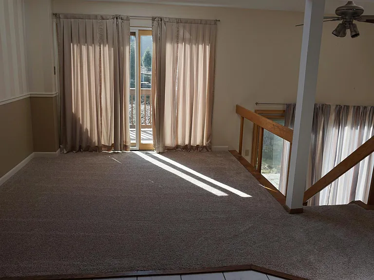 Dining area leading out to expanded rear deck and lower patio