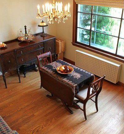Formal dining room with hardwoods and room to entertain.