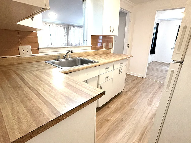 Kitchen with view from bathroom / bedroom door area