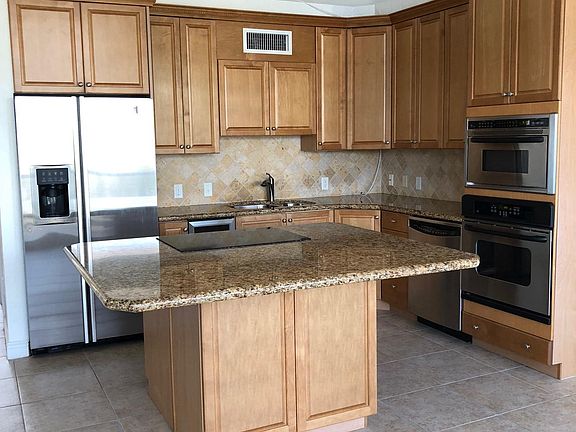 Kitchen with microwave, oven, dishwasher, wine cooler, side 