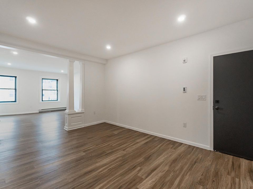Front Door leading into dining/flex space and family room in front.