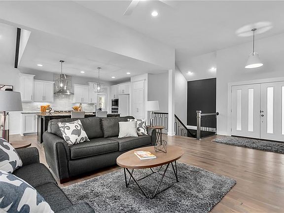 OPEN STAIRCASE LEADSDOWN TO THE FINISHED LOWER WALKOUT LEVEL