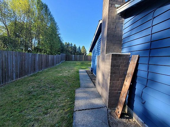 side of house; fully fenced backyard; backs up to greenbelt