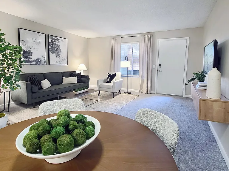 Welcome to your elegant living room, adorned with plush carpets or stylish wood-style flooring, creating the ideal environment for both entertainment and relaxation.