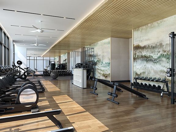 Rooftop club-quality fitness studio with Peloton bikes, TRX system, and a 270-degree view of the Atlanta skyline.