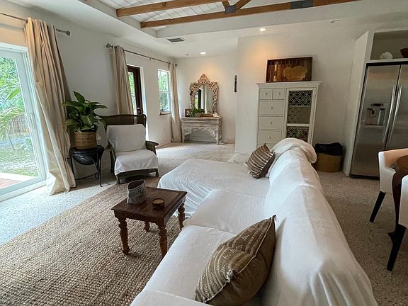 Open concept living area kitchen and dinning all overlooking the garden with a water view.