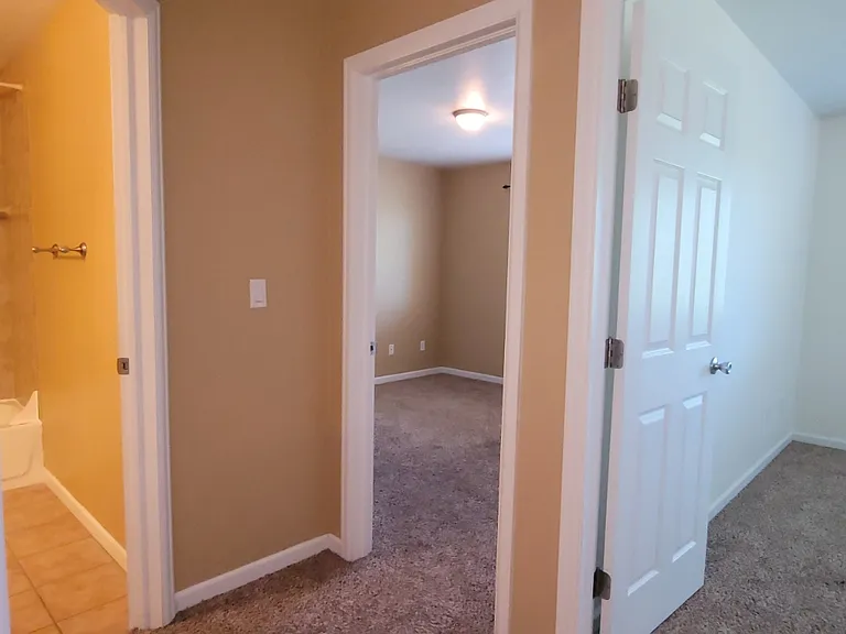 Turn around and the guest bedrooms and guest bathroom are at the top of the stairs. Stairs are to the right off the picture.