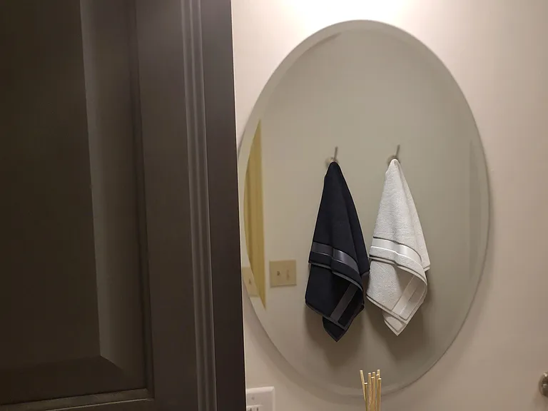 Bathroom with floor-to-ceiling cabinet, soft-close doors, updated hardware, new sink and quartz countertop.