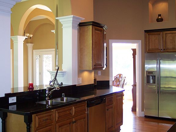 Kitchen w/open view into living room