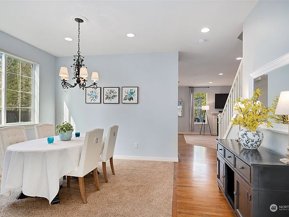 Glass French doors open to the privacy of a den or home office conveniently located on the main floor. >