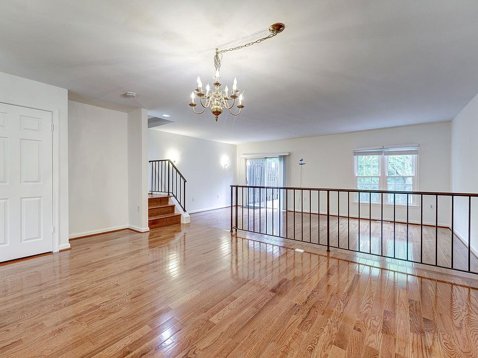 Open floor plan shows stunning hardwood floor throughout Dining and Living Rooms