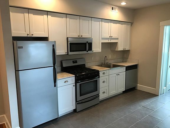Custom cabinets, marble countertops, and stainless steel appliances!
